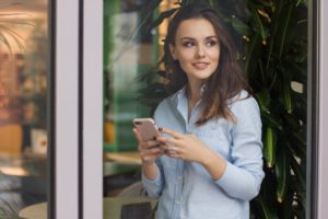 A user holds a smartphone. Some people who don't use email have smartphones with texting capability and a web browser.  